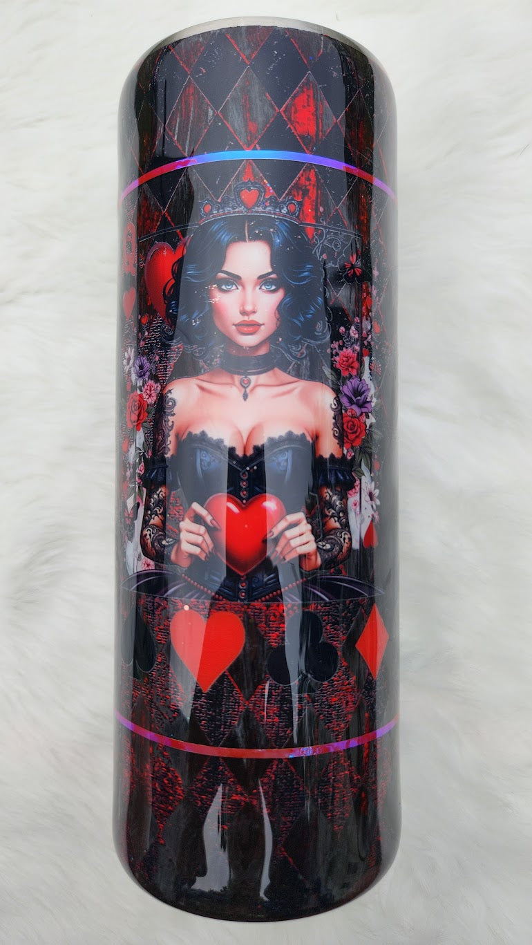 "Glossy tumbler with a dark gothic design featuring a queen-like woman with black wavy hair, blue eyes, and a jeweled crown with a red heart. She wears a black corset and lace sleeves, holding a large red heart in her hands. The background includes roses, playing card suits, and a red-and-black diamond harlequin pattern."